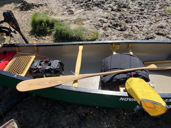 The completed paddle, on a canoe