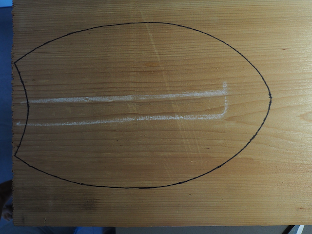 Marking out the outline of the handplane.