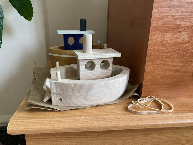Two toy boats. One finished and one ready to be painted.